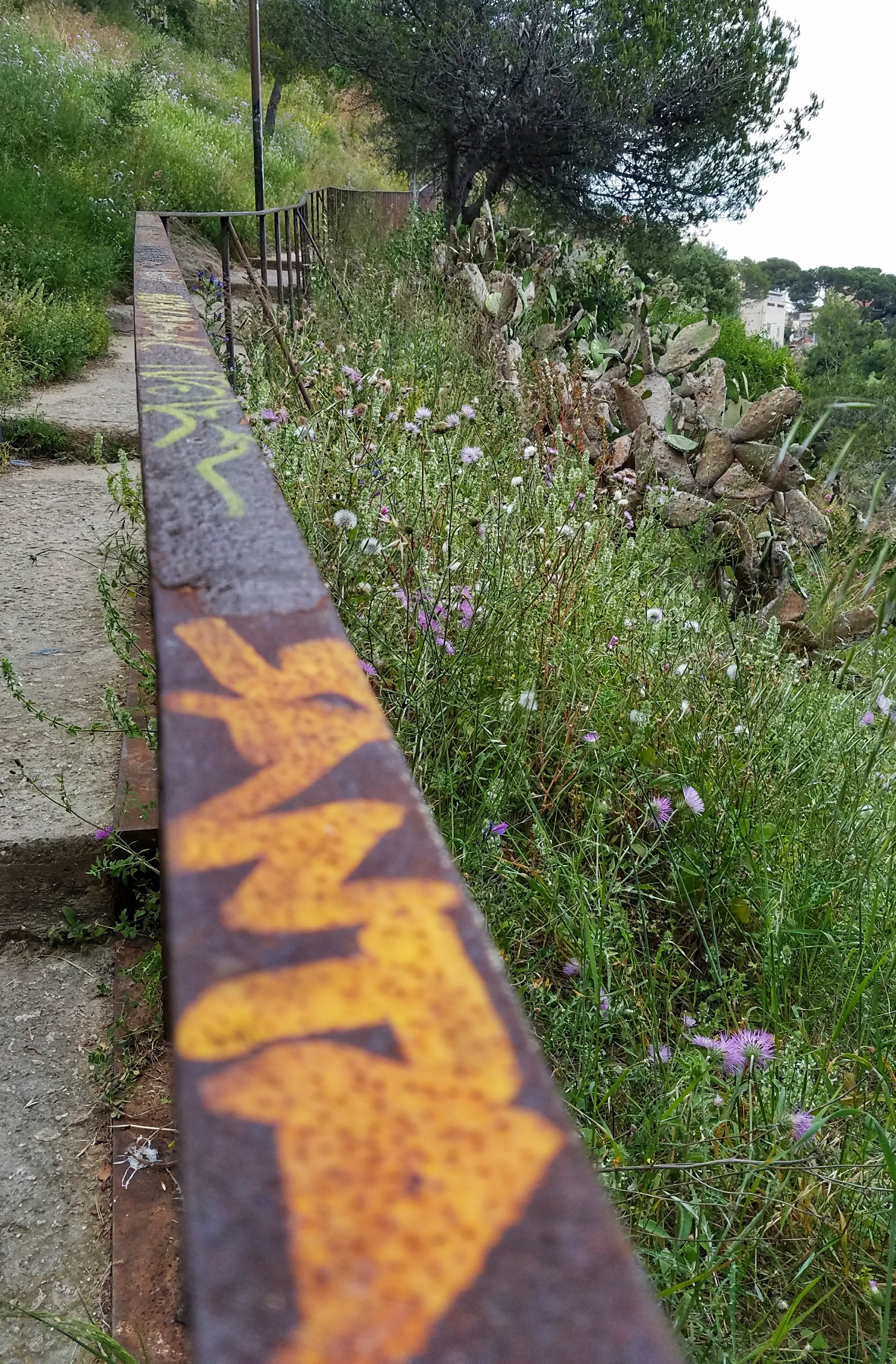 Path with rusty railing in Barcelona Spain