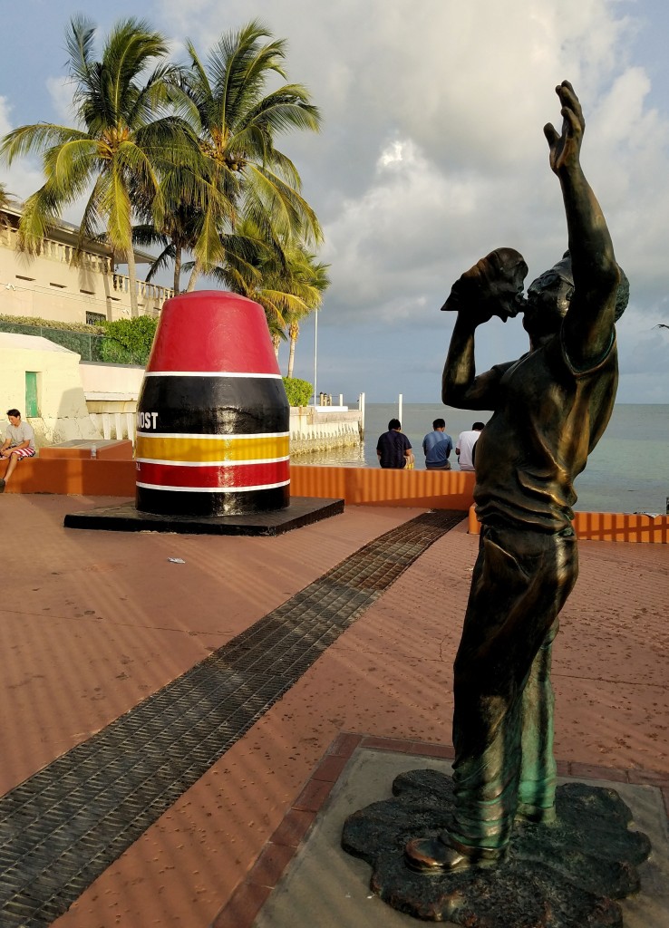 Statue of man blowing into a conch shell at Southernmost Point Key West Florida