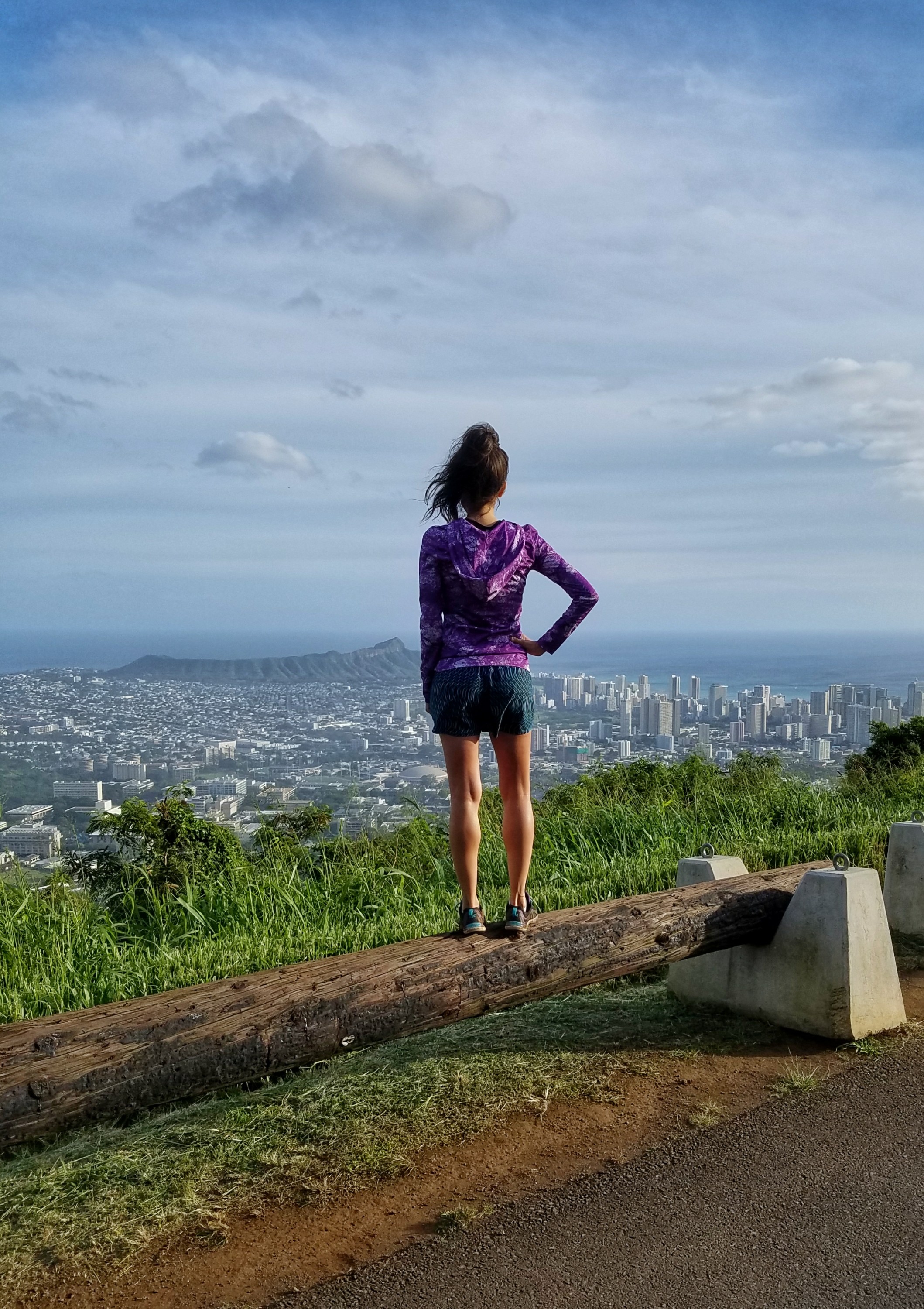 Woman standing at an overlook over Honolulu Hawaii
