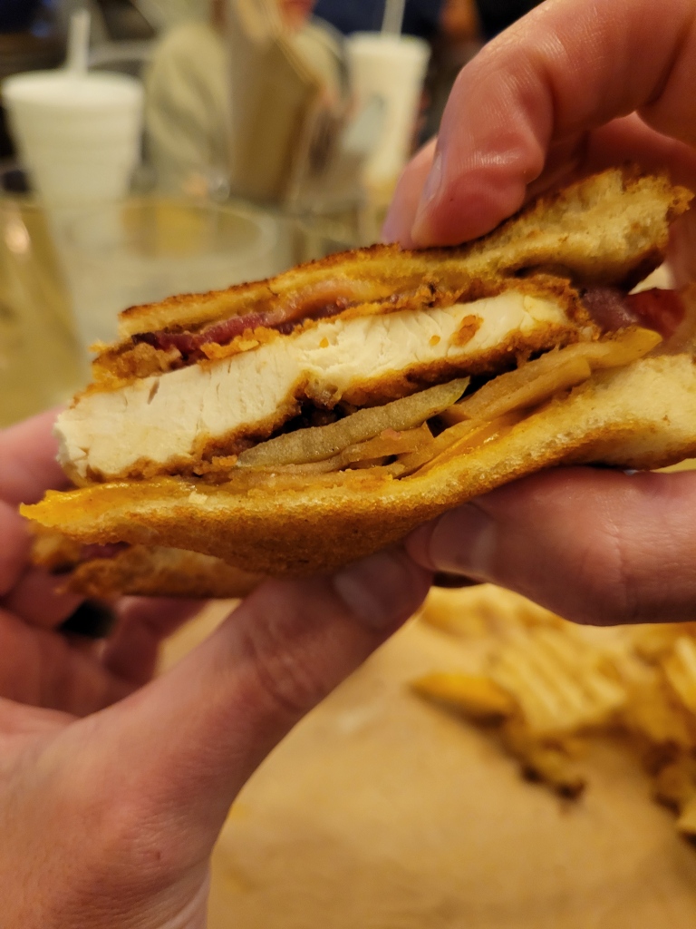Close up of fried chicken and apple pie sandwich