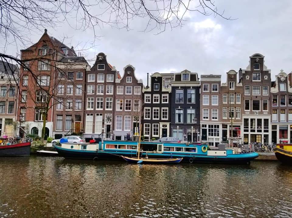 Row houses along a canal in Amsterdam The Netherlands 